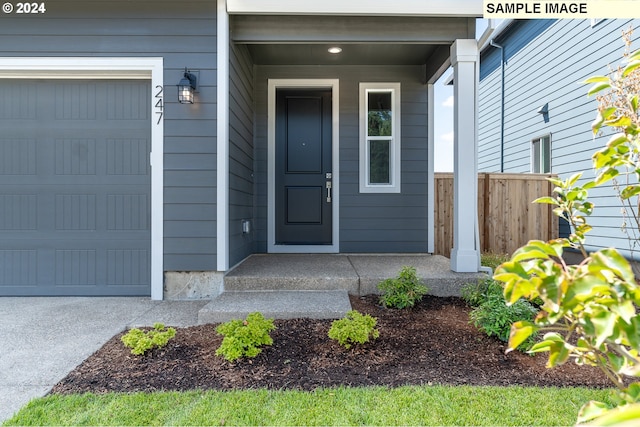 doorway to property featuring a garage