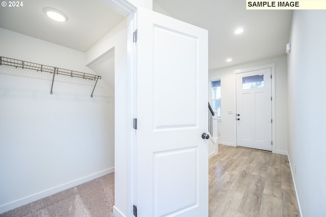 walk in closet featuring light hardwood / wood-style floors