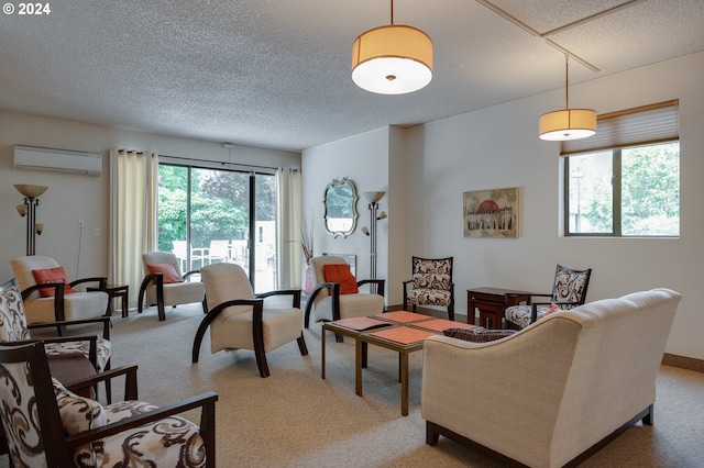 carpeted living room featuring an AC wall unit and a textured ceiling