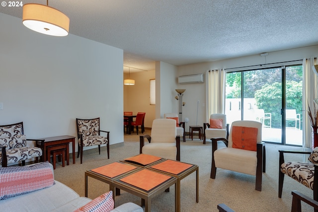 carpeted living room featuring an AC wall unit and a textured ceiling