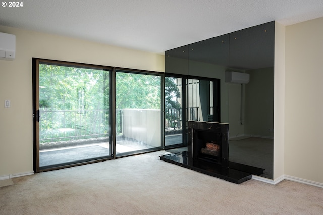 unfurnished living room featuring a wood stove, a wall unit AC, and light carpet