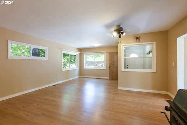 unfurnished living room featuring light hardwood / wood-style floors