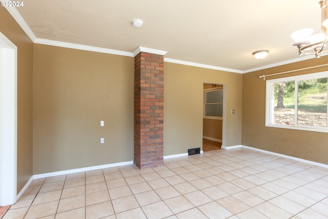 tiled spare room with ornamental molding and ornate columns