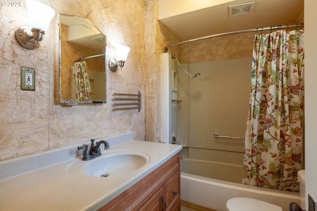 full bathroom with vanity, toilet, and shower / tub combo with curtain