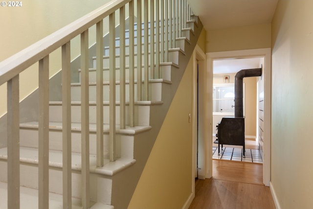 stairway featuring wood-type flooring