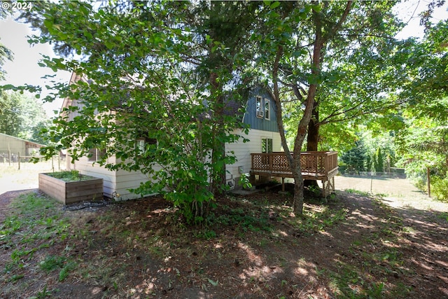 exterior space featuring a wooden deck