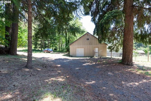 view of home's exterior with an outdoor structure