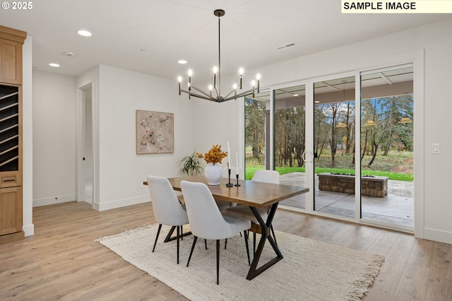 dining room featuring light wood-style floors, recessed lighting, visible vents, and baseboards