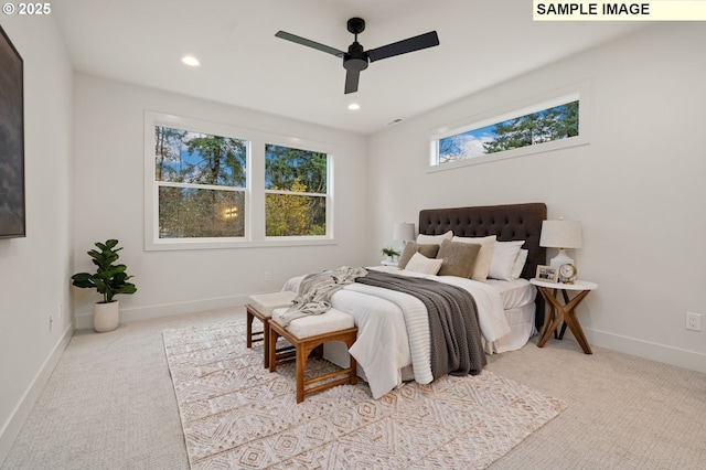 bedroom with recessed lighting, light carpet, ceiling fan, and baseboards