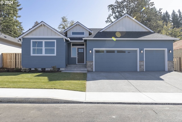 view of front facade featuring a front yard and a garage