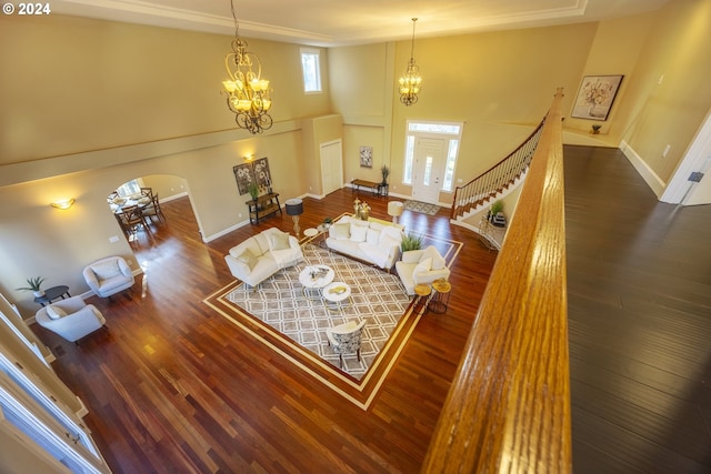 living room featuring dark wood-type flooring and a notable chandelier