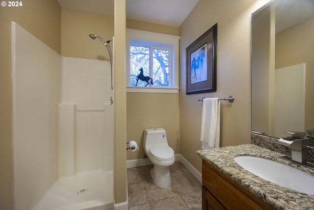 bathroom with tile patterned floors, a shower, vanity, and toilet