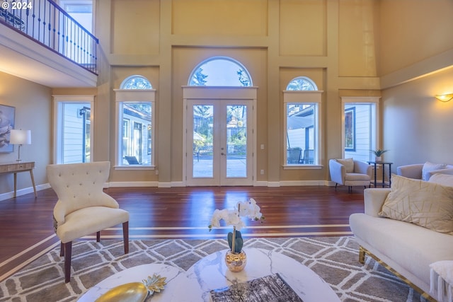 12989 SE Mountain Gate Rd, Happy Valley, OR 97086 - living room featuring a towering ceiling, wood finished floors, and french doors