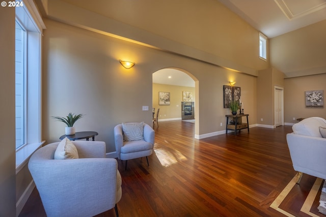 12989 SE Mountain Gate Rd, Happy Valley, OR 97086 - living room with arched walkways, wood finished floors, and a high ceiling
