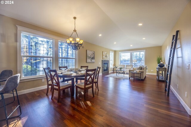 12989 SE Mountain Gate Rd, Happy Valley, OR 97086 - dining space with dark wood-style floors, a chandelier, recessed lighting, a fireplace, and lofted ceiling