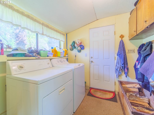 washroom with light colored carpet, separate washer and dryer, and cabinets