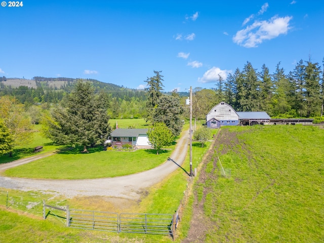 birds eye view of property featuring a rural view