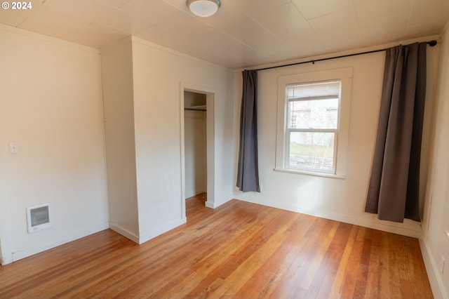 410 N Mountain Blvd, Mount Vernon, OR 97865 - unfurnished bedroom with baseboards, a closet, light wood-style flooring, and visible vents
