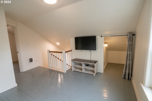 unfurnished living room with lofted ceiling and dark hardwood / wood-style floors