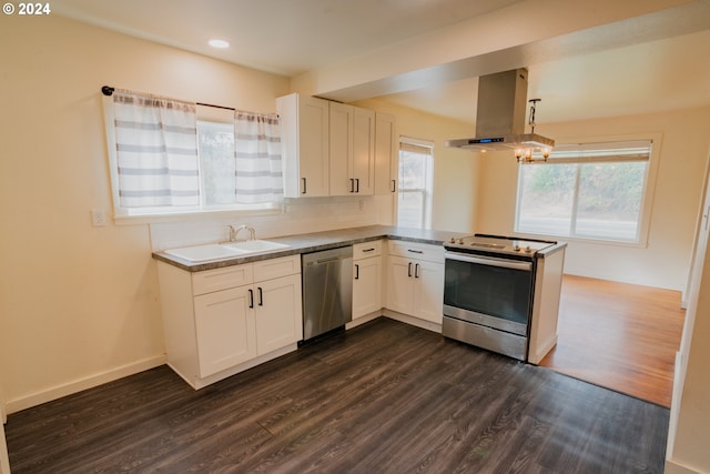 410 N Mountain Blvd, Mount Vernon, OR 97865 - kitchen featuring dark wood-style flooring, a peninsula, ventilation hood, a sink, and stainless steel appliances