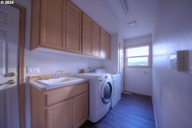 washroom with separate washer and dryer, cabinets, sink, and light hardwood / wood-style floors