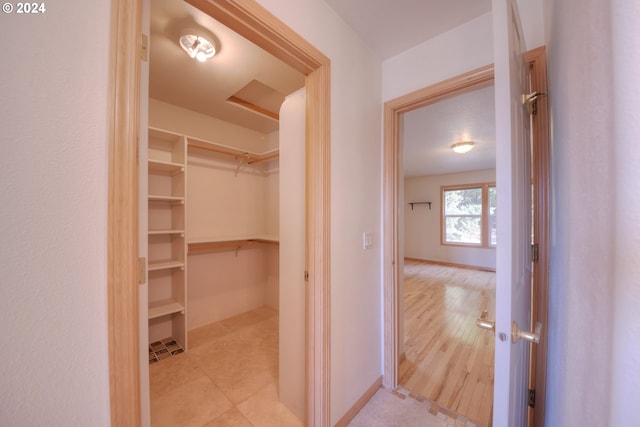 walk in closet featuring light wood-type flooring