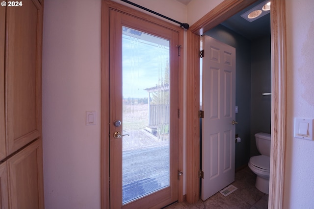 entryway with tile patterned floors