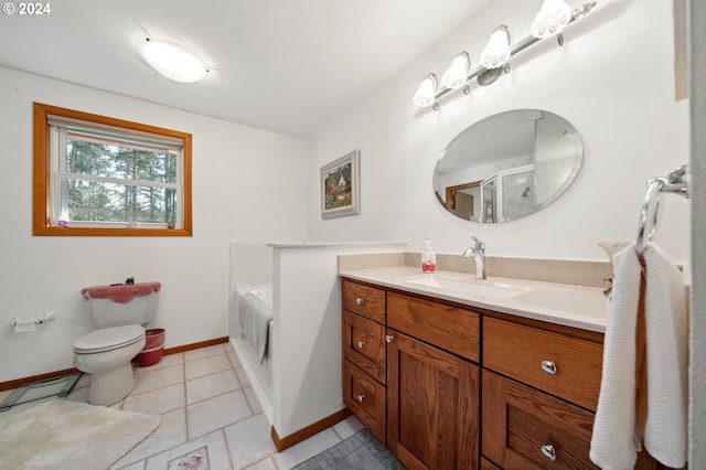 bathroom with toilet, tile flooring, a bath, and vanity