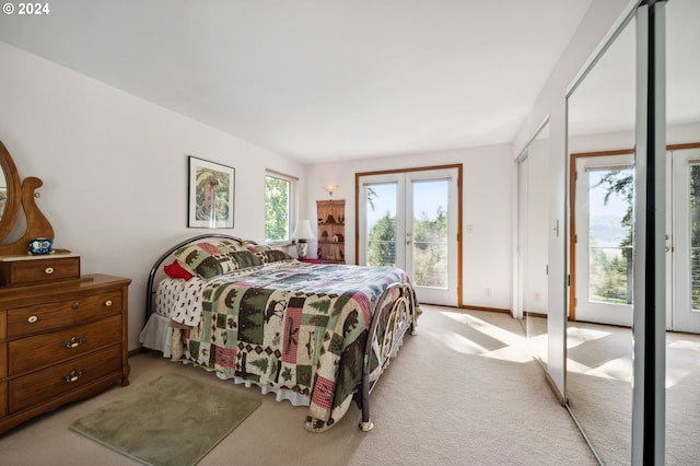 carpeted bedroom with access to exterior