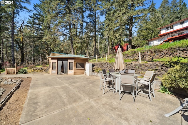 view of patio featuring an outdoor structure