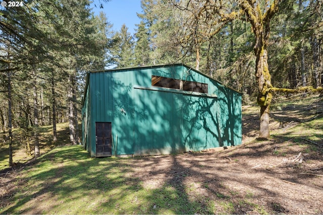 view of shed / structure featuring a yard