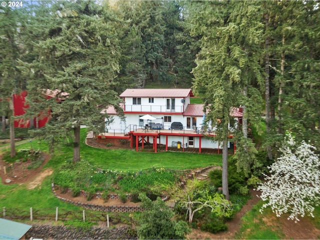 exterior space with a lawn and a wooden deck