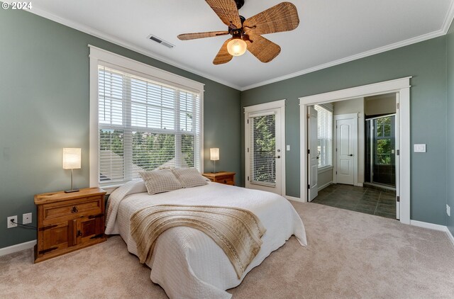 carpeted bedroom featuring crown molding and ceiling fan