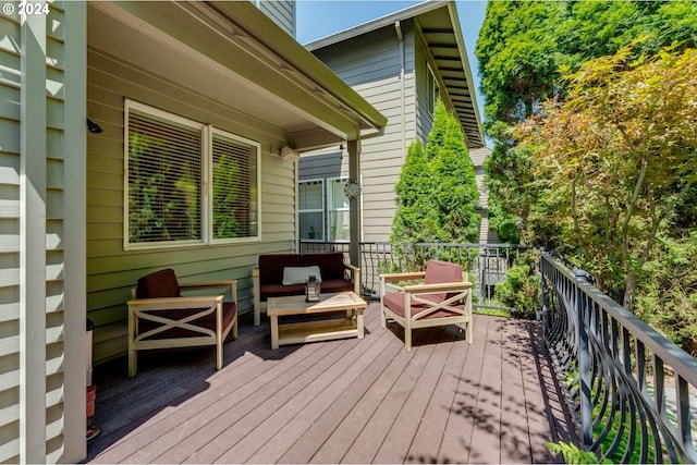 wooden terrace with an outdoor hangout area