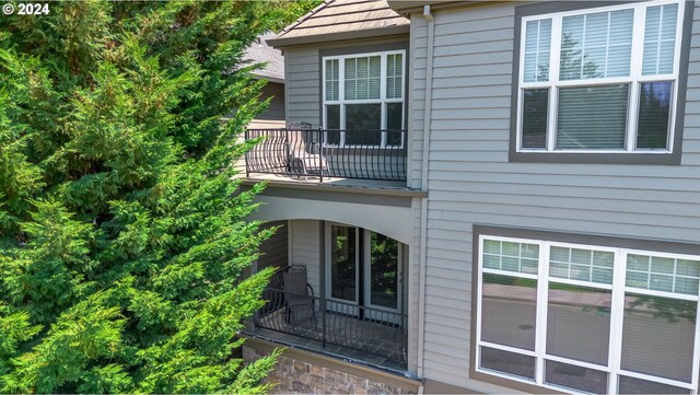 view of home's exterior with a balcony