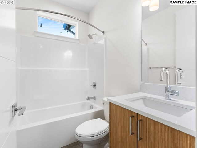 full bathroom featuring bathing tub / shower combination, vanity, and toilet