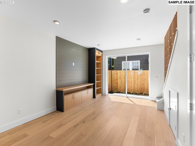 unfurnished living room featuring light hardwood / wood-style floors