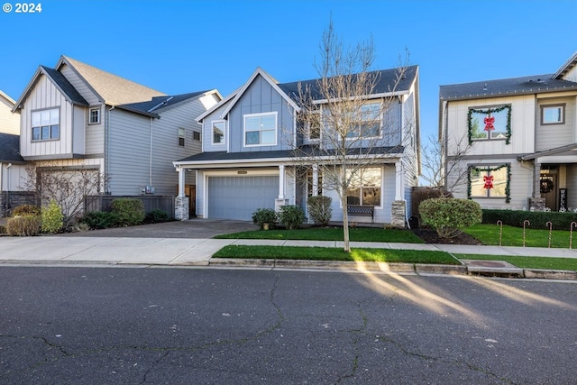 multi unit property with a garage and a front lawn