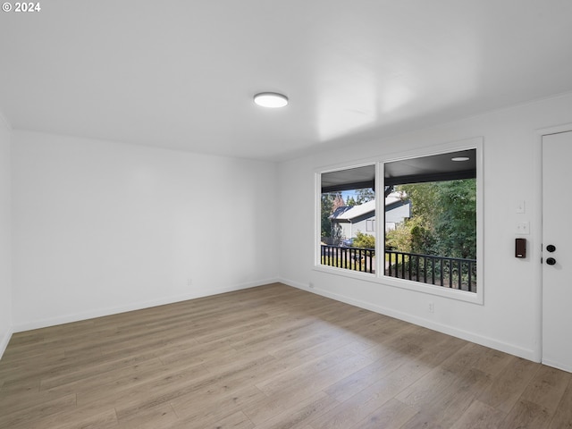 empty room with light hardwood / wood-style floors