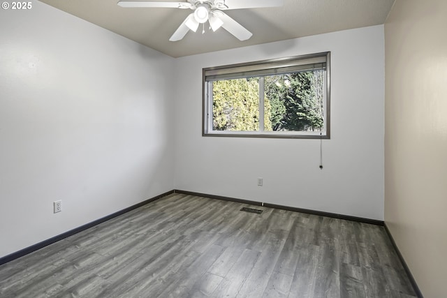 empty room featuring hardwood / wood-style flooring and ceiling fan