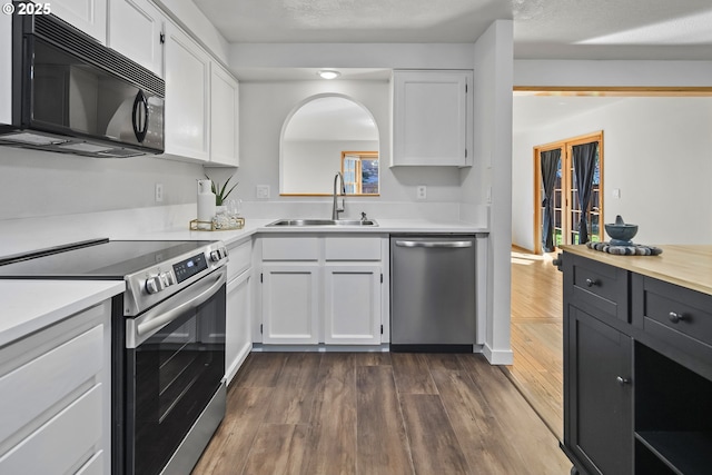 kitchen with white cabinetry, appliances with stainless steel finishes, and sink