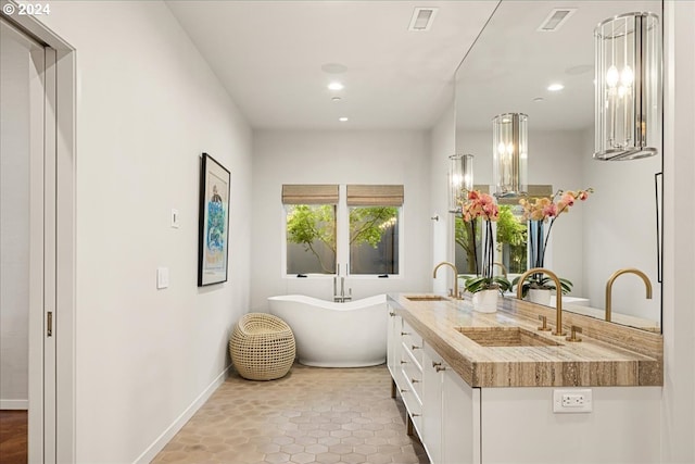 bathroom with vanity and a bathtub