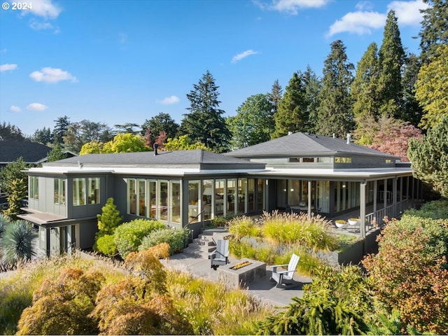 1933 Highlands Loop, Lake Oswego, OR 97034 - back of house featuring a fire pit, a sunroom, and a patio area