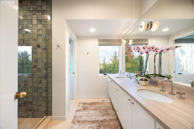 1933 Highlands Loop, Lake Oswego, OR 97034 - full bath with double vanity, a tile shower, and recessed lighting