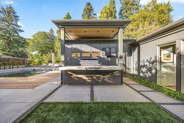 view of patio / terrace with a fenced in pool