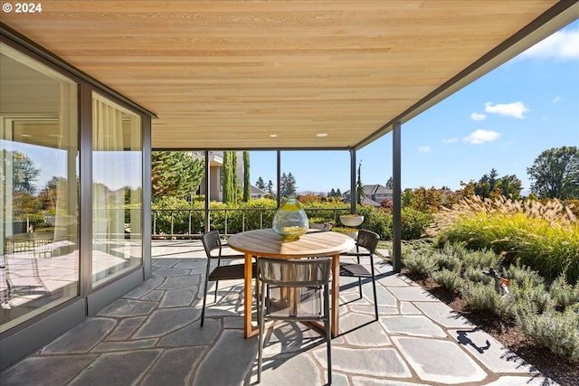 1933 Highlands Loop, Lake Oswego, OR 97034 - sunroom / solarium featuring wooden ceiling, stone floors, floor to ceiling windows, and outdoor dining area