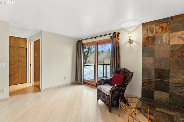 sitting room featuring light wood-type flooring