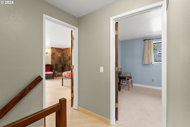 corridor with light colored carpet