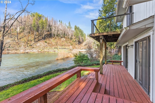 deck featuring a water view