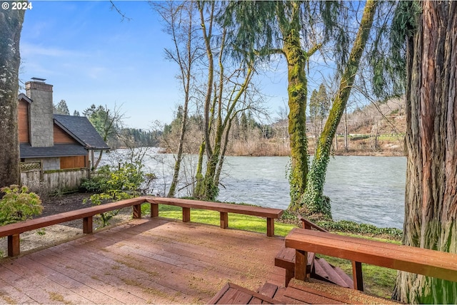 wooden deck with a water view